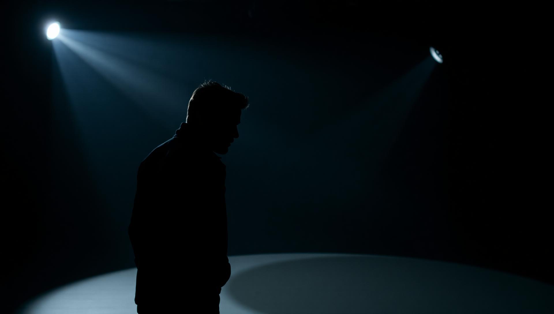 Actor in dramatic studio lighting